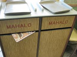 Trash bins at a Waikiki restaurant marked "Mahalo"