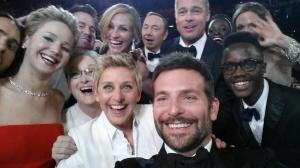 Bradley Cooper, foreground, takes the photo that went viral on Oscar night