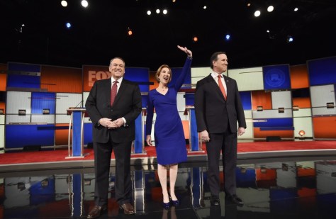 Fiorina waves to the audience at the start of the undercard Republican presidential debate