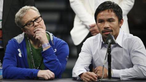 Pacquiao, right, with his coach Freddie Roach